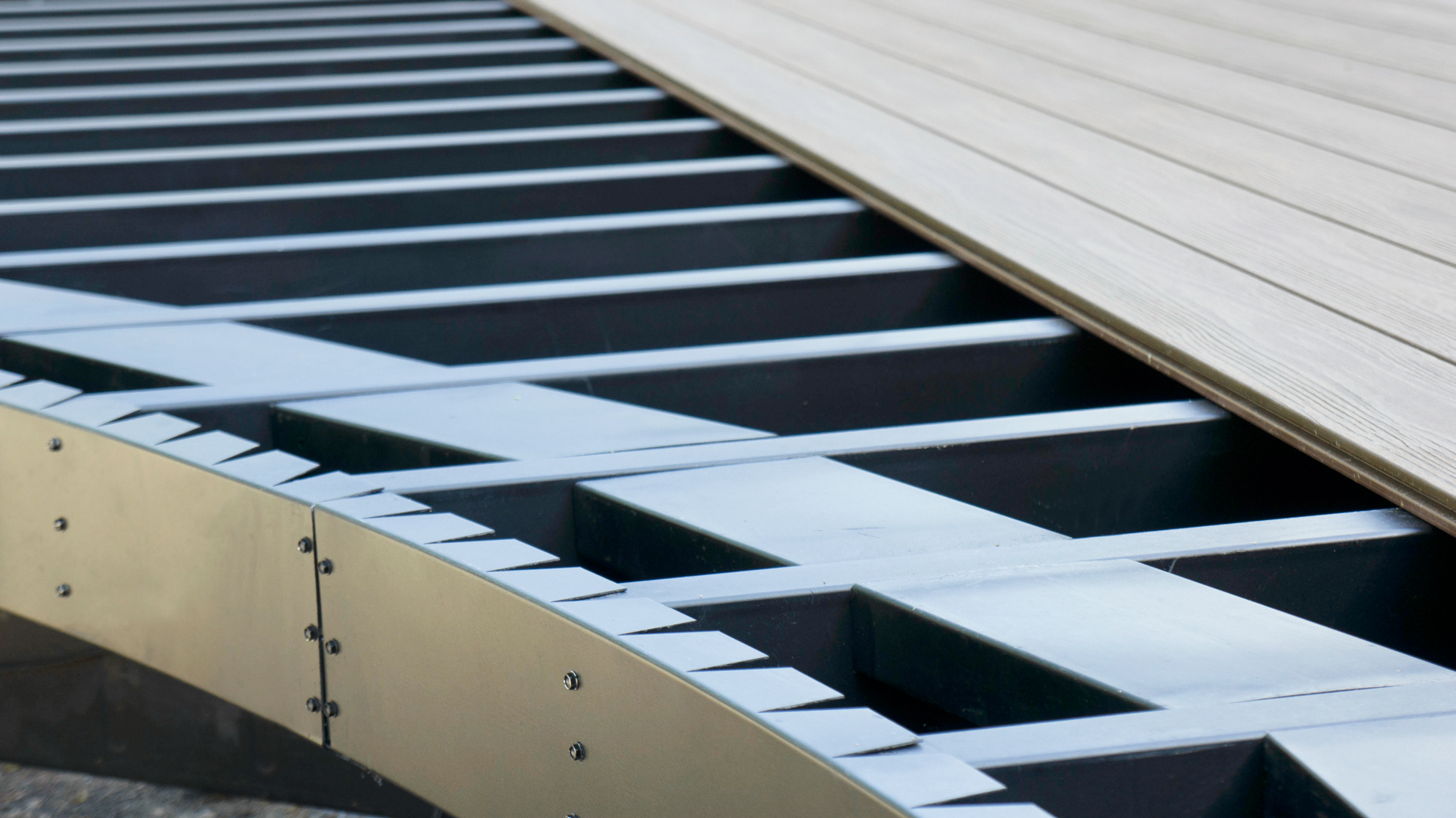 Close up of composite deck boards installed on steel framing.