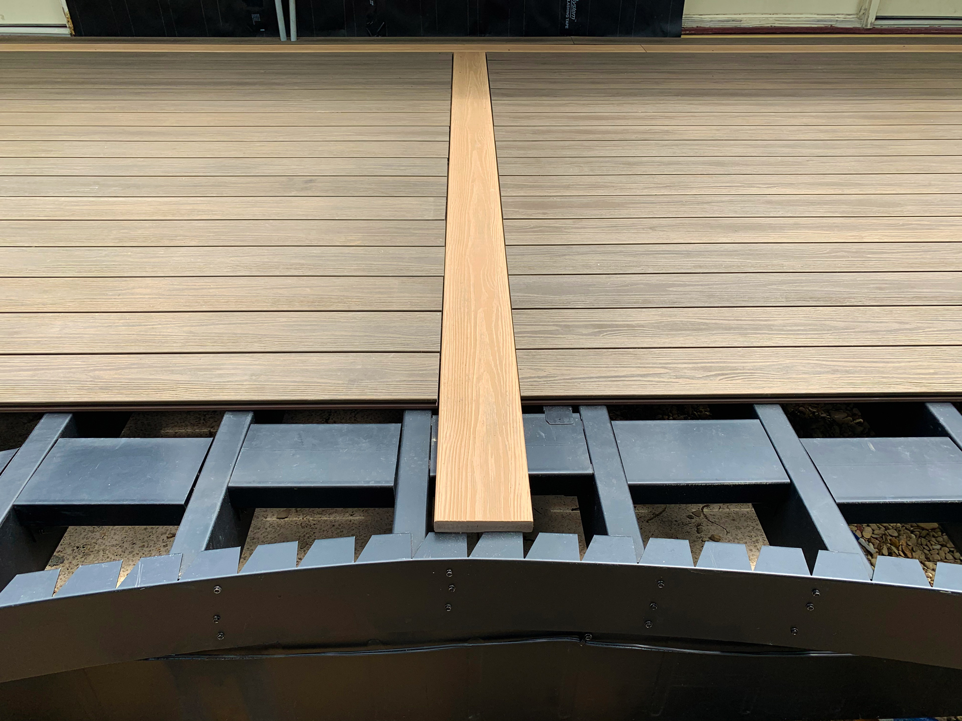 Close up of partially built decking with the steel deck frame showing.