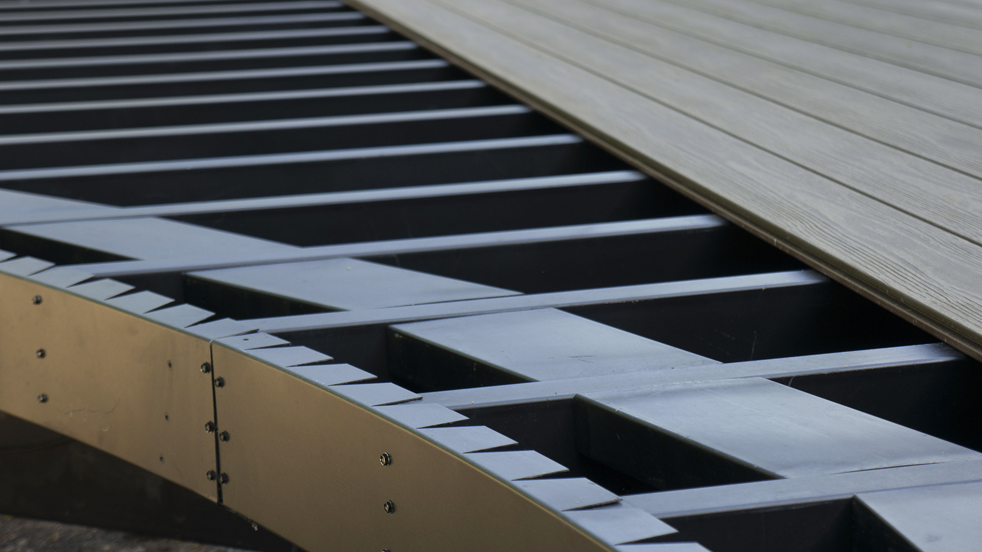 close up image of composite deck boards laid across steel framing