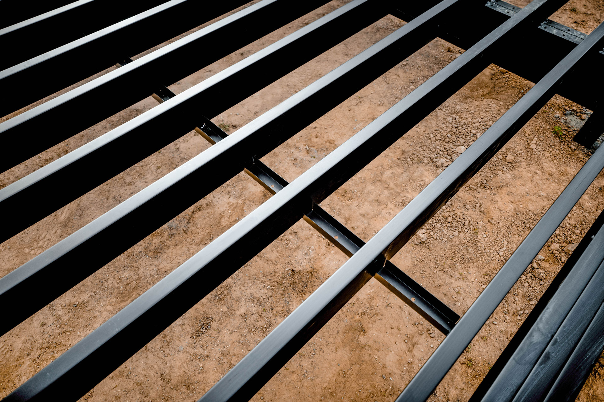 Above view of  black steel deck framing.